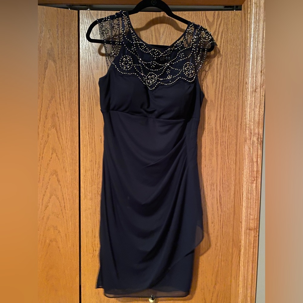 Navy blue dress. Knee length.